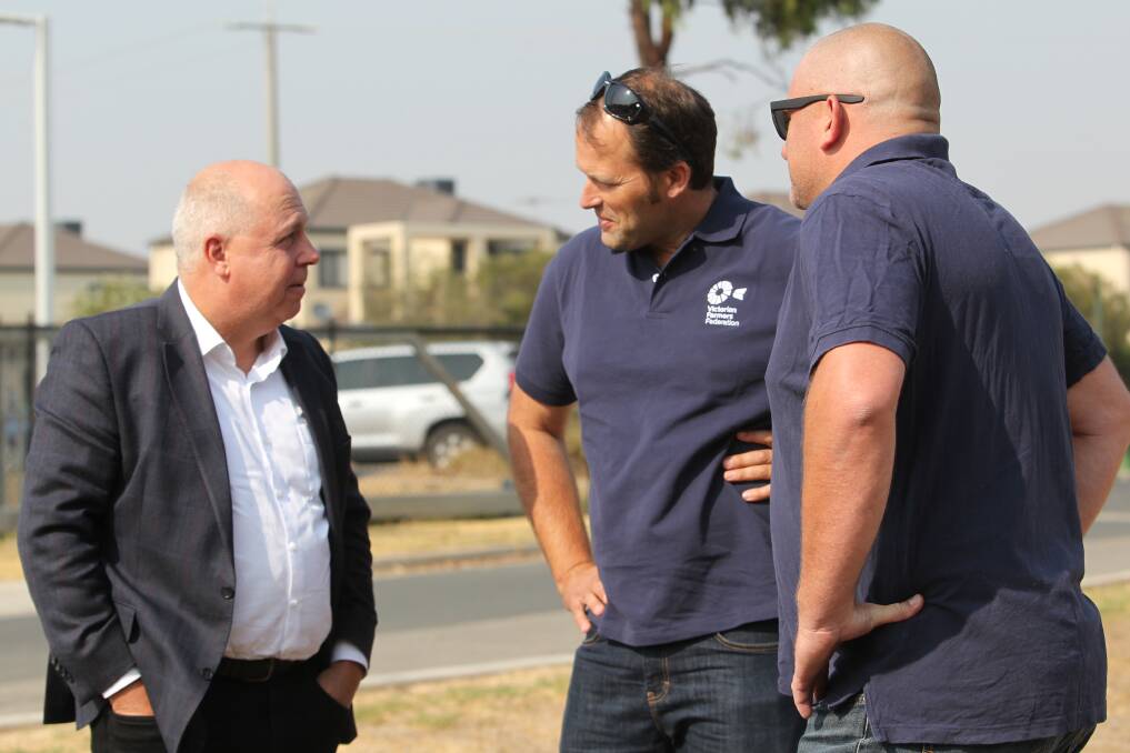HELP FOR FARMERS: Victorian treasurer Tim Pallas and VFF president David Jochinke toured the Wodonga incident control centre during their North East visit on Friday. Picture: SHANA MORGAN