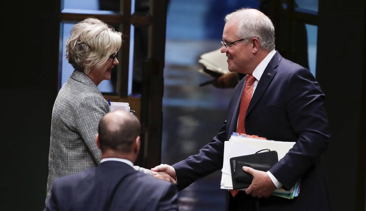 MEETING THE MAN: Indi MP Helen Haines and Prime Minister Scott Morrison shake hands on Thursday in Parliament's House of Representatives. Picture: ALEX ELLINGHAUSEN