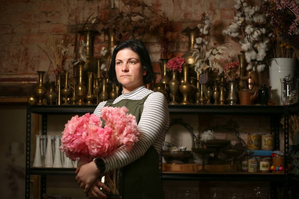 A BUNCH OF SACRIFICES: Corowas Poppy Emporium owner Katie Massari has moved from her Rutherglen home to stay with her sister across the border. Pictures: JAMES WILTSHIRE