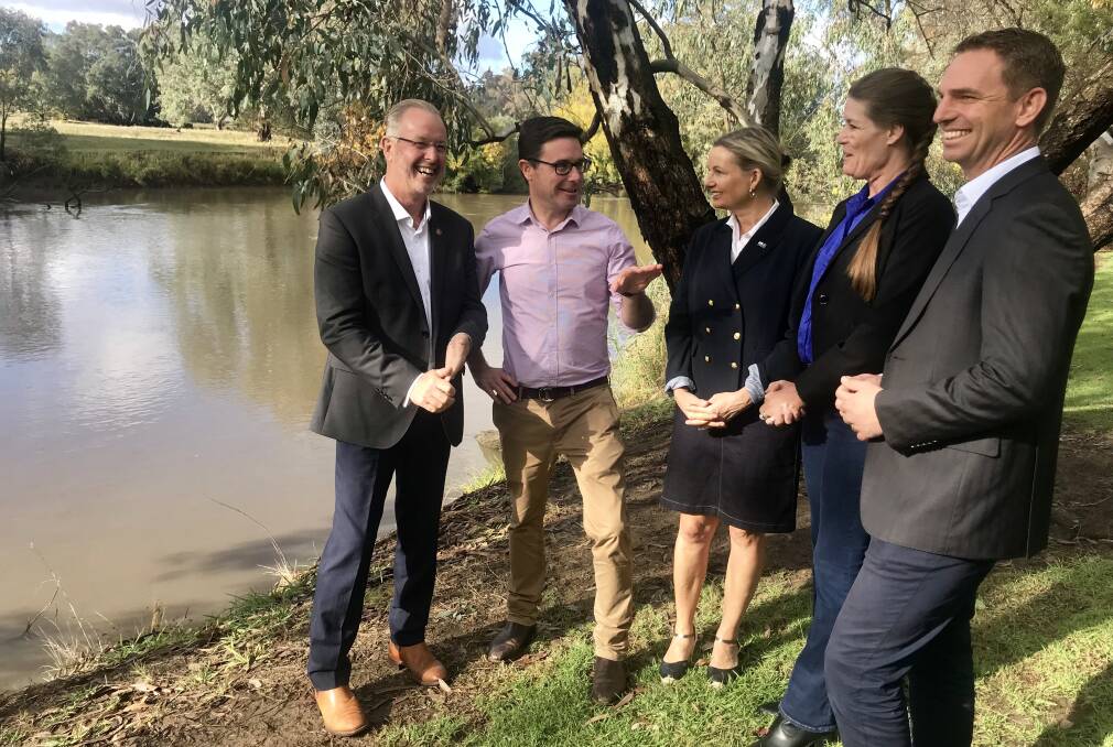 BY THE MURRAY: Mark Byatt, Minister David Littleproud, Sussan Ley, Senate candidate Perin Davey and Steve Martin in Wodonga yesterday. Picture: SHANA MORGAN