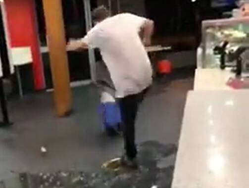 CONDEMNED: Michael Brown seen kicking his esky, as captured on mobile phone footage.