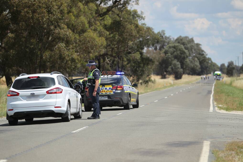 CLOSED: Police blocked Rutherglen-Springhurst Road on Tuesday as the jury viewed the crash scene.