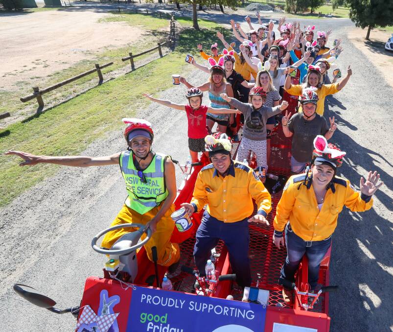 POPULAR CAUSE: Cyclists powered the five-tonne Big Red Bike around Howlong as part of this year's Good Friday Appeal.