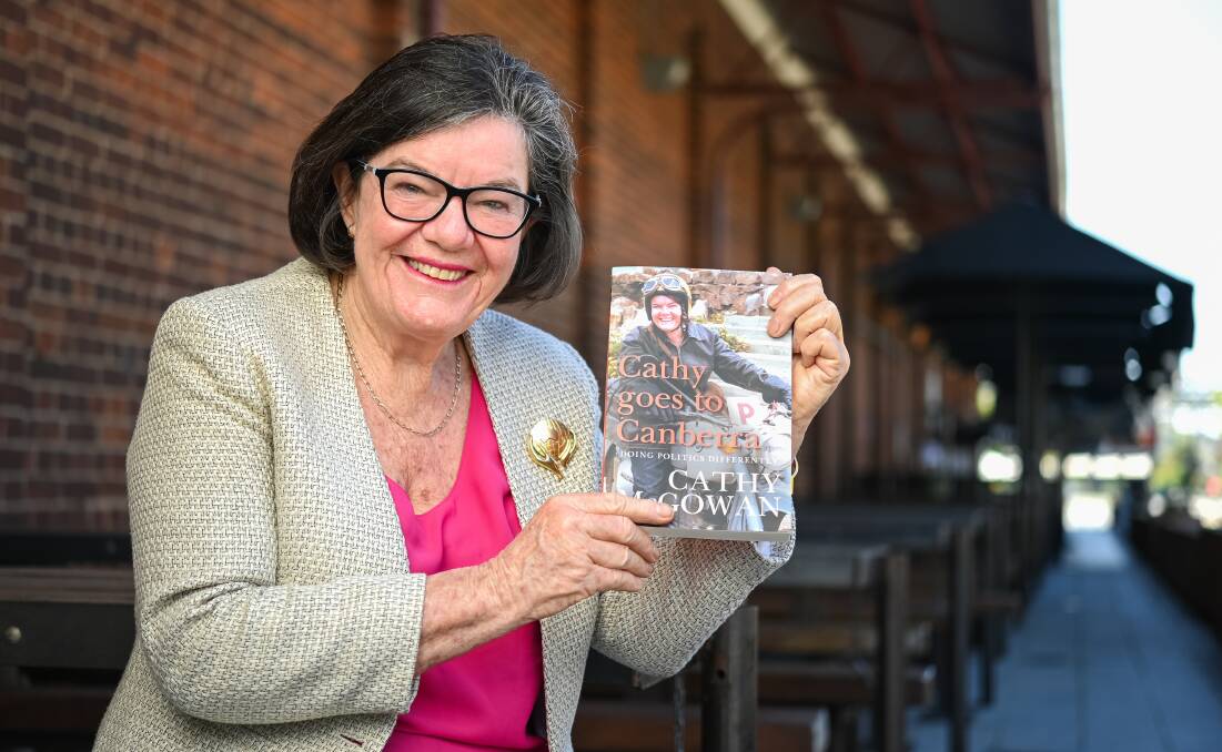 YEARS IN THE MAKING: Cathy McGowan's new book features a photo of her on the cover at 22 years old, on the motorbike she used to get between home and university. Picture: MARK JESSER