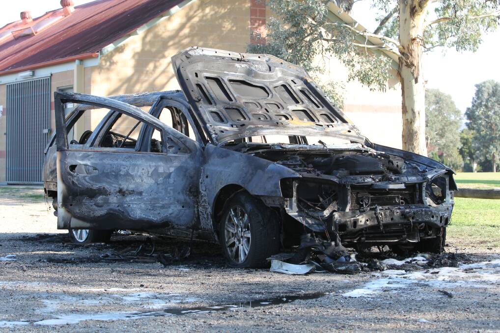 BURNT OUT: This vehicle belonging to Albury Taxis was found destroyed by fire at Sarvaas Park in North Albury on Wednesday morning. Pictures: SHANA MORGAN