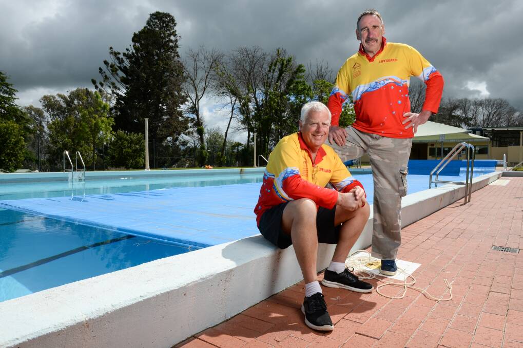 HELPING STUDENTS: Lifeguards Ray Terrill and Jim Bell are among the team at Rutherglen pool.