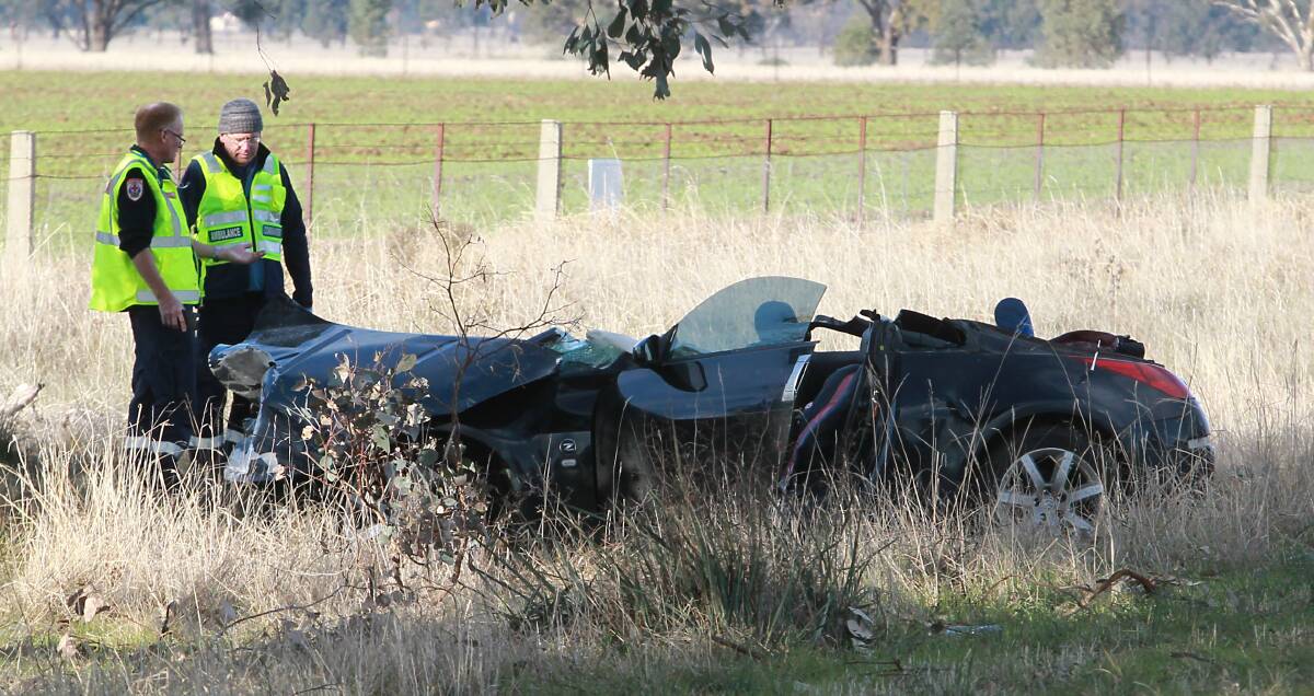CRASH SCENE: Jess McLennan was freed from her Nissan sports car after the crash. Drivers of two other cars were also treated by paramedics. Picture: BLAIR THOMSON