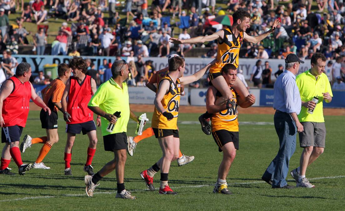 Jet pack: The Ovens and Murray Jets players celebrate at the end of their match as part of the O and M grand final program in Lavington.