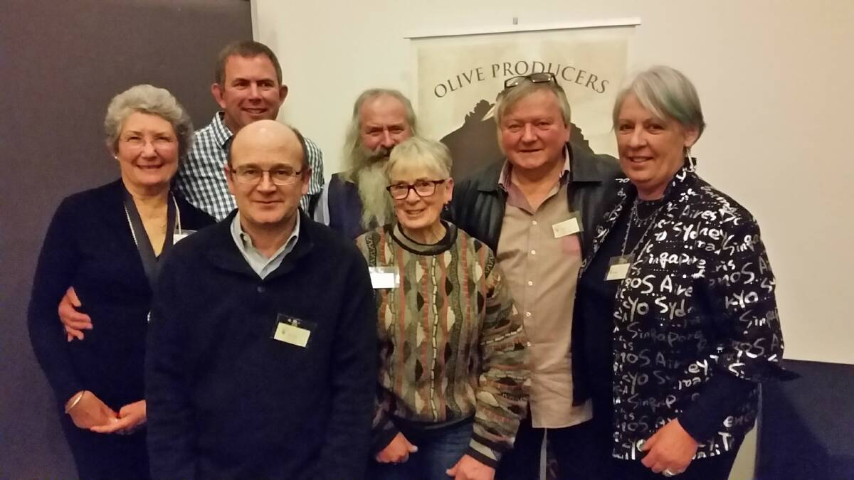 THE GOOD OIL: Head judge Shane Cummins, back centre, with representatives from Oils of Milawa, Barfold Olives and Wangandary Grove at the recent national awards.