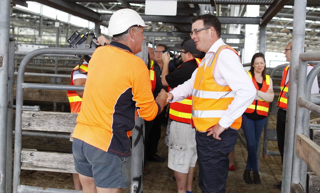 ON HAND: Victorian premier Daniel Andrews meets staff at the Wangaratta saleyards this week. Picture: LUKE PLUMMER, Wangaratta Chronicle