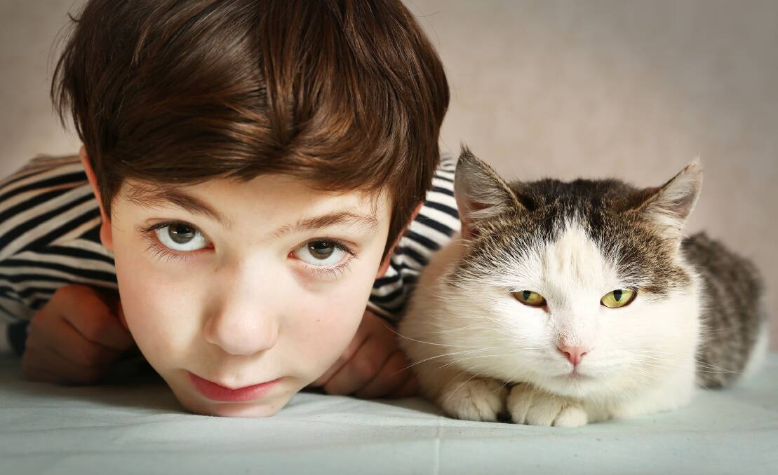 BEST FRIENDS: Children with pets may learn to be more empathic as they are taught to be gentle with animals.