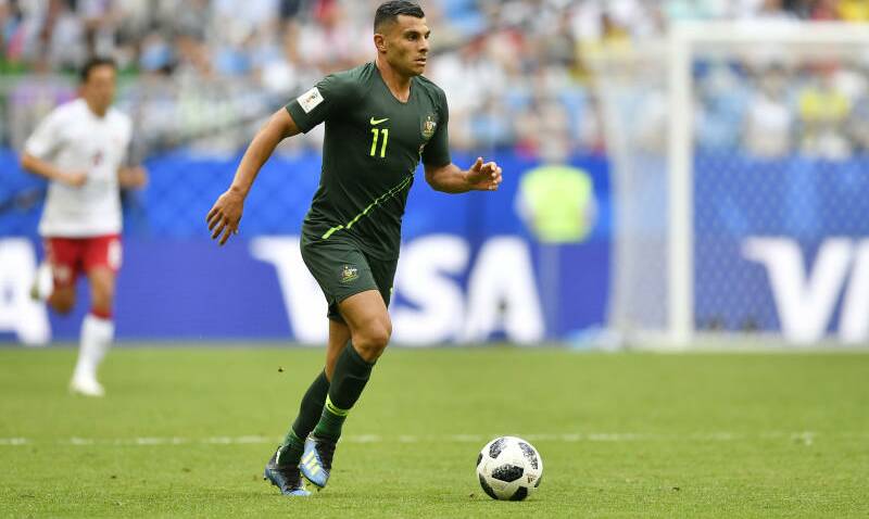 Australia's Andrew Nabbout goes with the ball during the group C match between Denmark and Australia. Photo: AAP