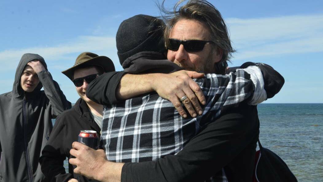 On dry land: Missing fishermen reunited with family after a week at sea
