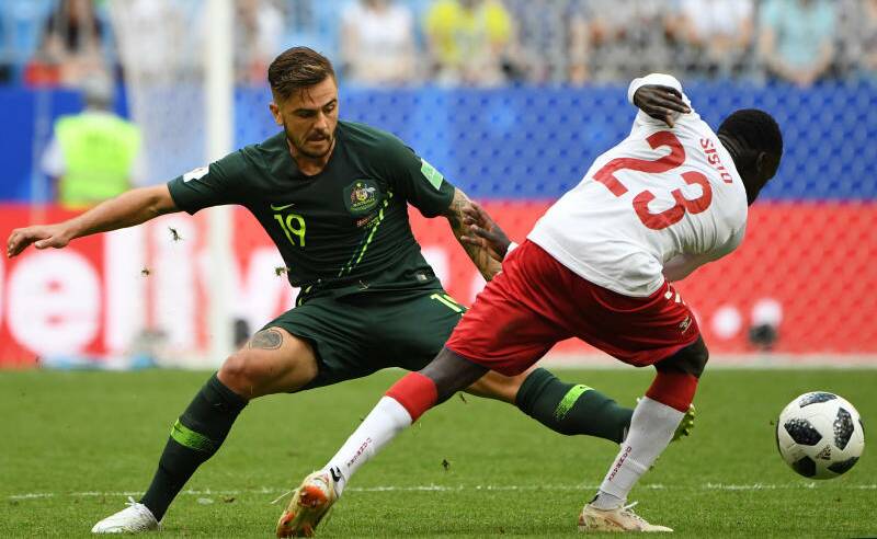 Australia's Josh Risdon tackles Pione Sisto of Denmark during their FIFA World Cup match. Photo: AAP