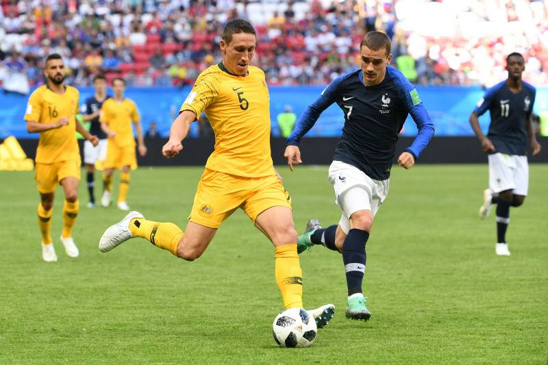 Australia's Mark Milligan takes on Antoine Griezmann of France during their FIFA World Cup group match. Photo: AAP