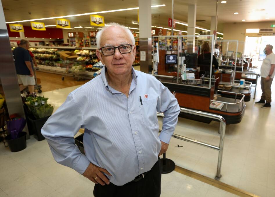 MASK MATTER: East Albury IGA owner Bob Mathews pictured with the protective screens used in his supermarket as a COVID-19 precaution.