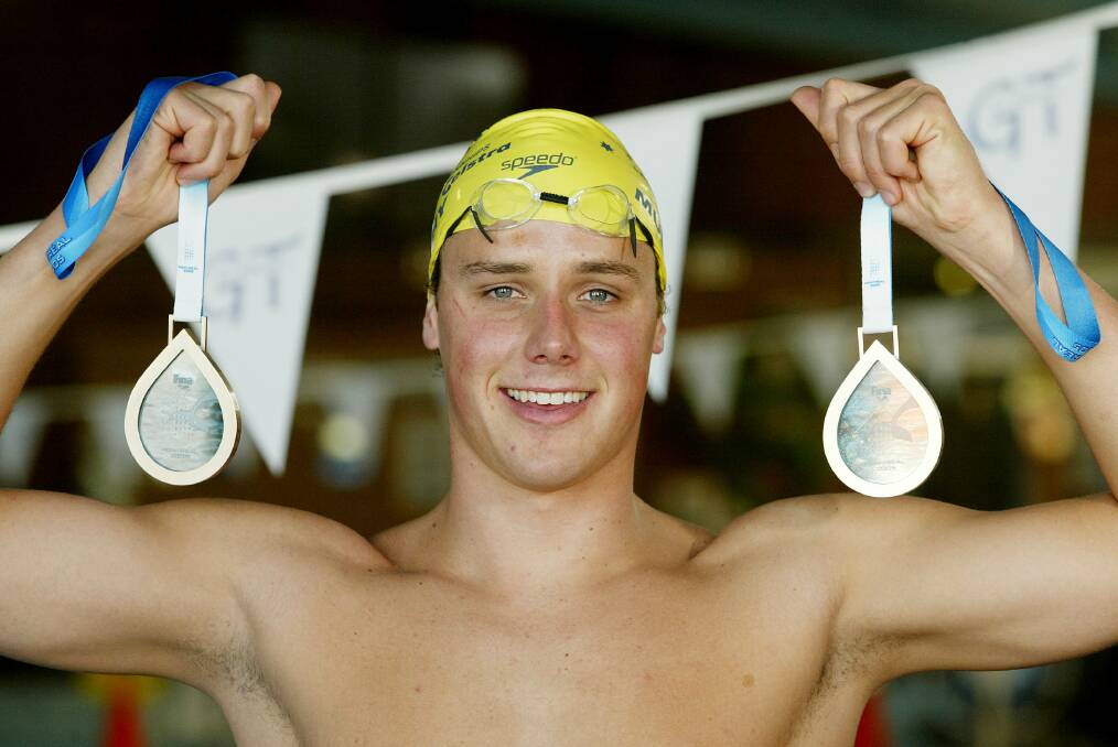 SWIMMING SUCCESS: Patrick Murphy pictured in Albury with his two World Championship bronze medals from Canada when he was 21-years-old.