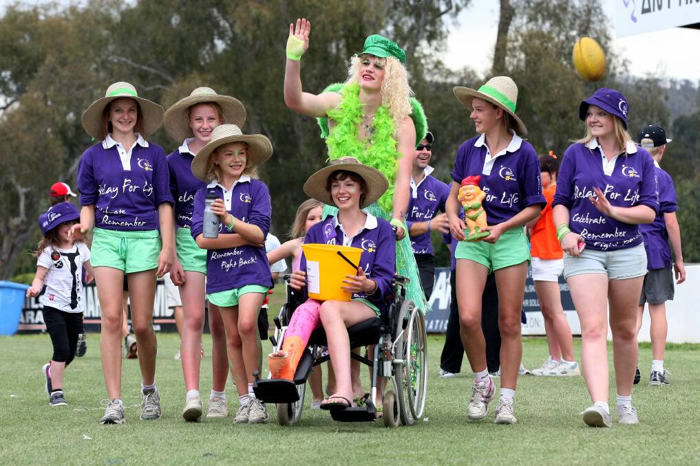 Imogen with family and friends at the 2011 Relay for Life in Albury being pushed by her cousin McKye Turner as part of team Turnz.
