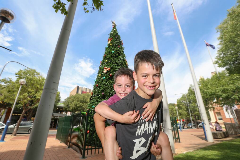 PIGGYBACK: Brothers Xavier Sarroff, 8, and Edward, 4, enjoyed the weekend with their mum Emily and aunty Lizzy Delarue.