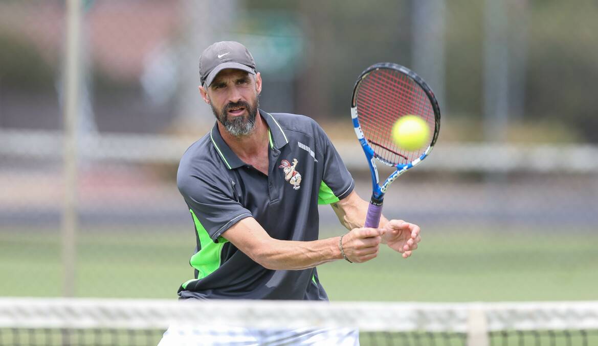 FRIENDLY RIVALS: Border Warriors' Ben Tari makes his way to the net in a doubles clash against the Wodonga Bushrangers during Country Week in Wodonga on Tuesday. Picture: TARA TREWHELLA