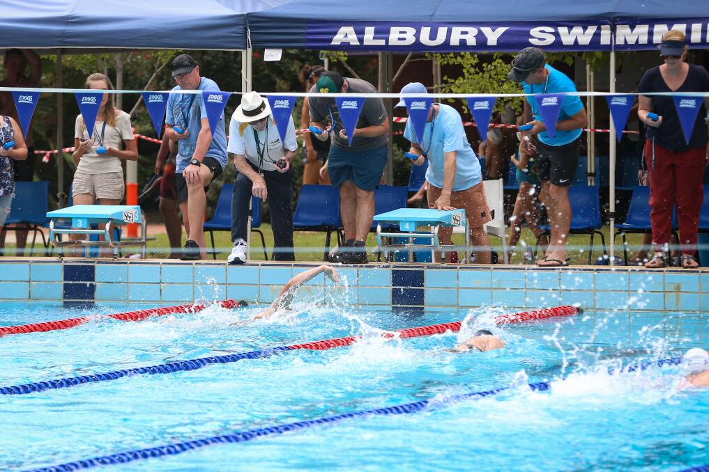 SPLASHING AROUND: Wodonga Amateur Swimming Club's Mackensey House touches the wall first in the 100m freestyle final at the O and M Championships on Sunday.