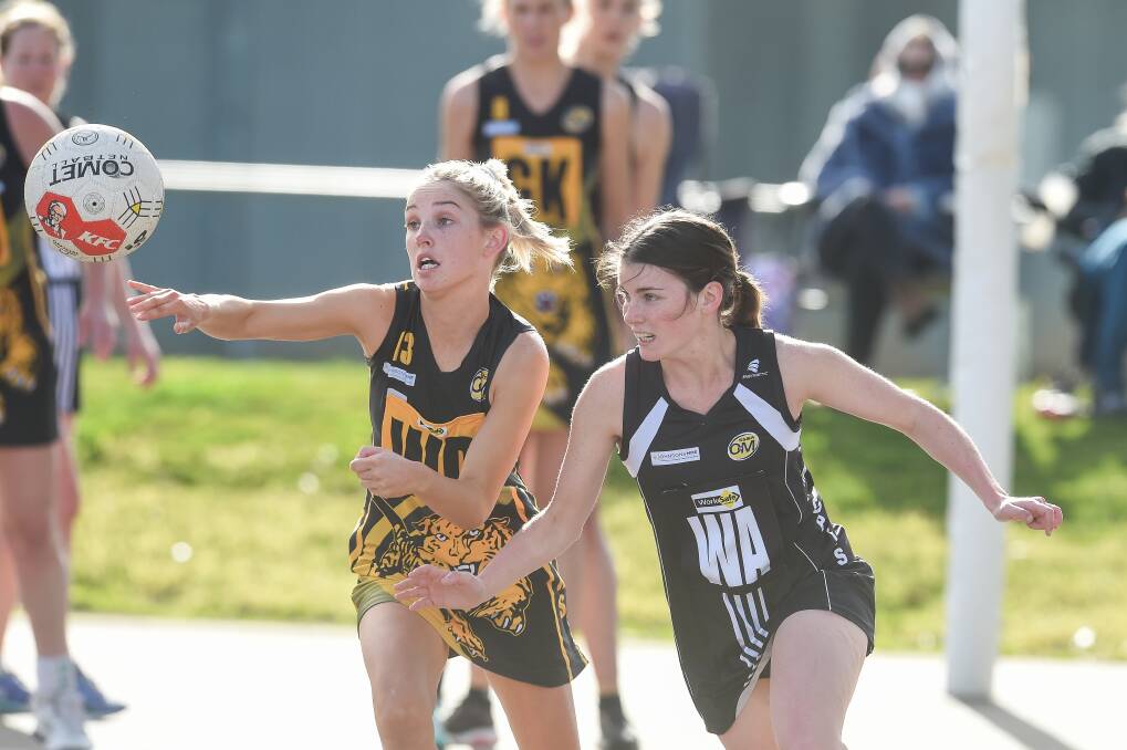 TUSSLE: Albury's Sharna Thomas and Wangaratta's Chaye Crimmins battle it out for possesion during the Magpies' win on Saturday.