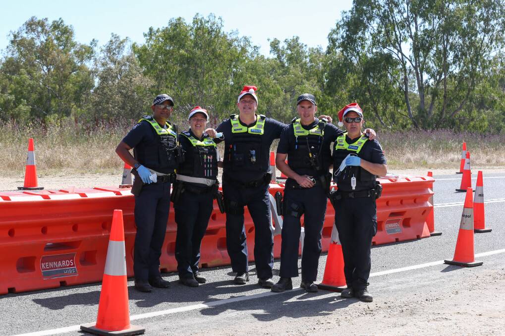 SACRIFICE: Victoria Police manning the Bonegilla Road checkpoint on Christmas Day due to the COVID-19 NSW-Victoria border closure. Pictures: TARA TREWHELLA