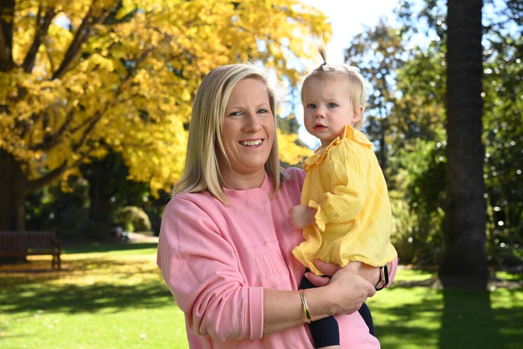 MEMORIES: Tamara Mathews with her youngest daughter Zoe, 1, as she reflects on the triumphs and heartaches of her Ovens and Murray netball career. Picture: MARK JESSER