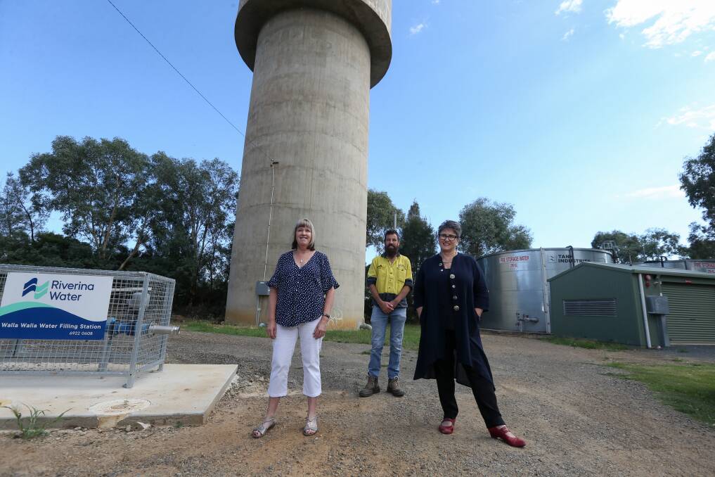 BLANK CANVAS: Leonie Carey and Daniel Nadebaum from the Walla Community Development Committee alongside Silo Art Committee chair Virginia Scholz at the town's water tower. Picture: TARA TREWHELLA