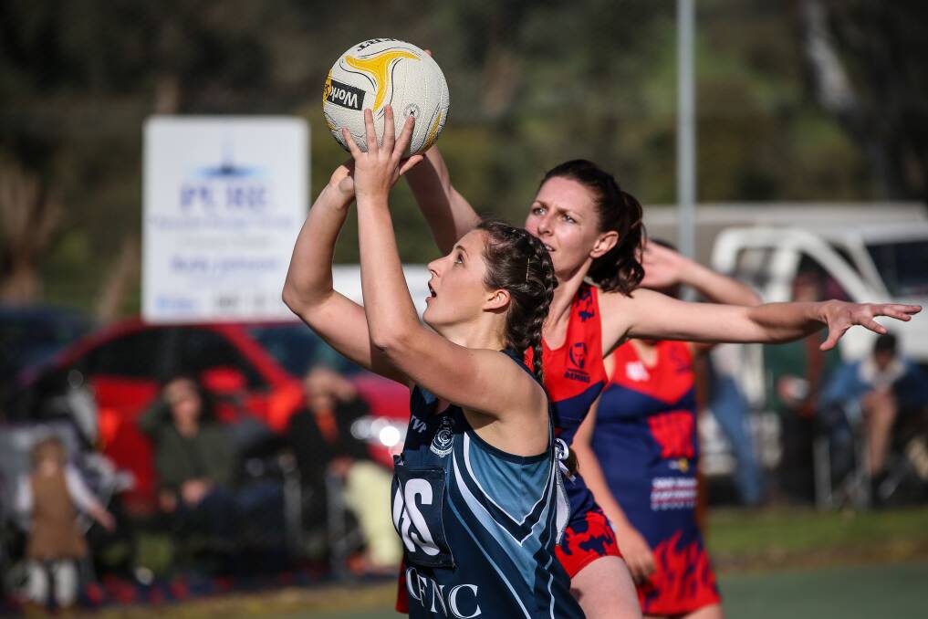 ON FIRE: Cudgewa shooter Sophie Greenhill in action during last year's Upper Murray league netball grand final.