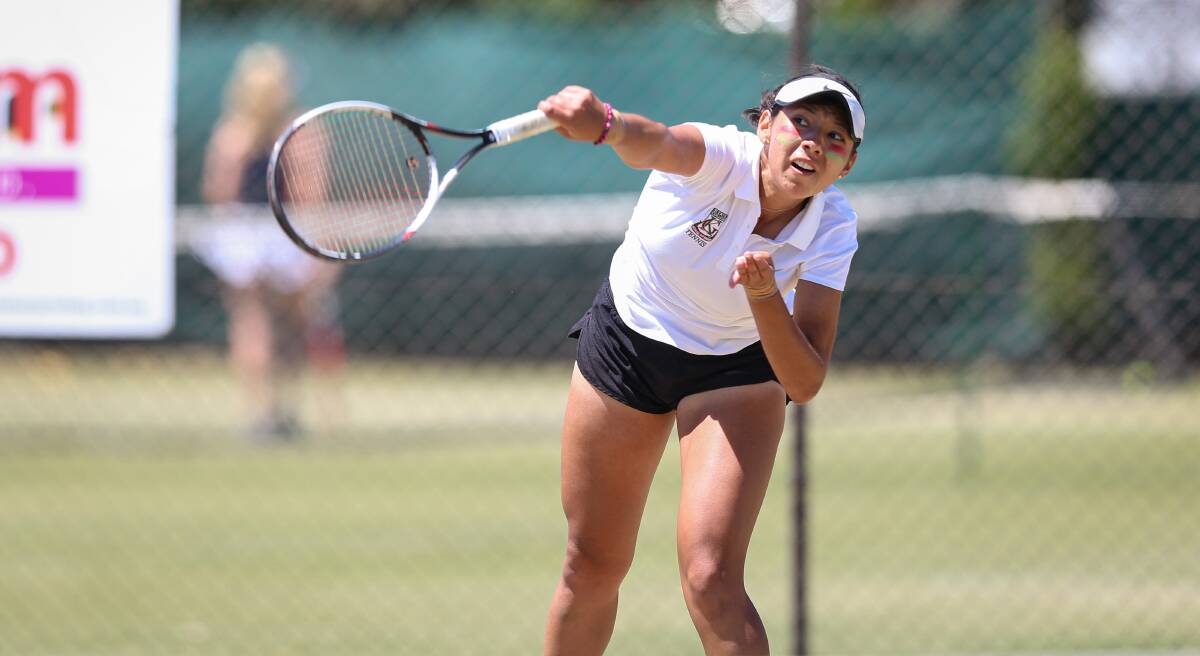 DETERMINED: Kelvin Grove State College's Javiera Castro serves during the girls final at the Albury grasscourts. Pictures: JAMES WILTSHIRE.