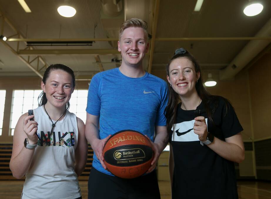WHISTLES HANDY: Budding basketball referees Susie Maber, Lachlan Coathupe and Kaitlyn Neate at the referee camp held at the Scots School Albury on Sunday. Picture: TARA TREWHELLA.