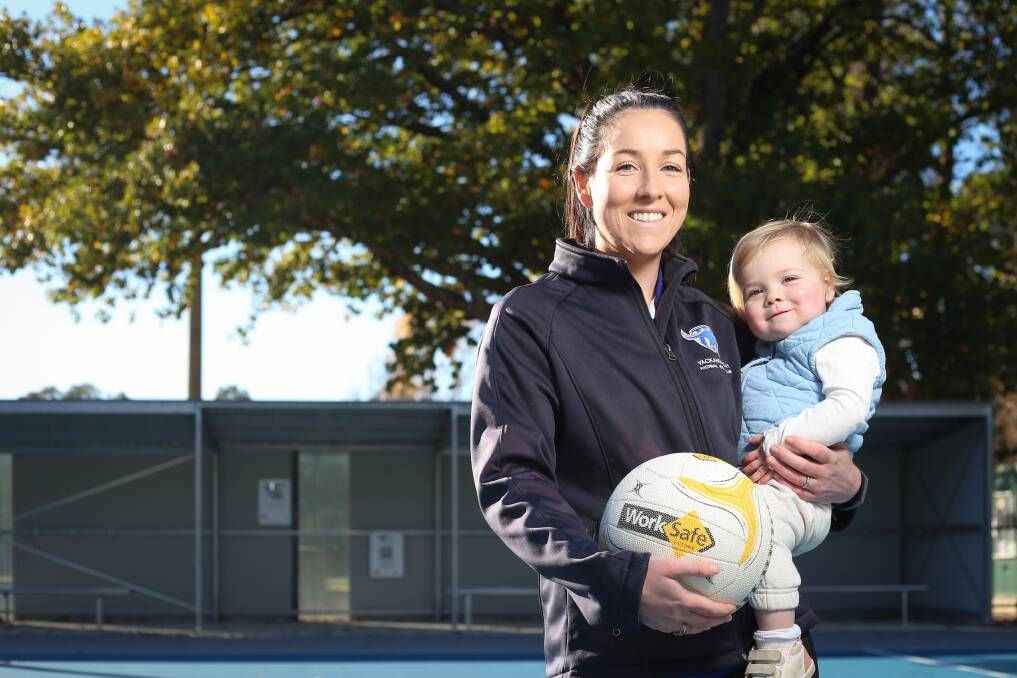MUM'S THE WORD: Emma Maslen with one-year-old daughter Molly at Yackandandah's Butson Park, the club which holds many memories for her family. Picture: JAMES WILTSHIRE