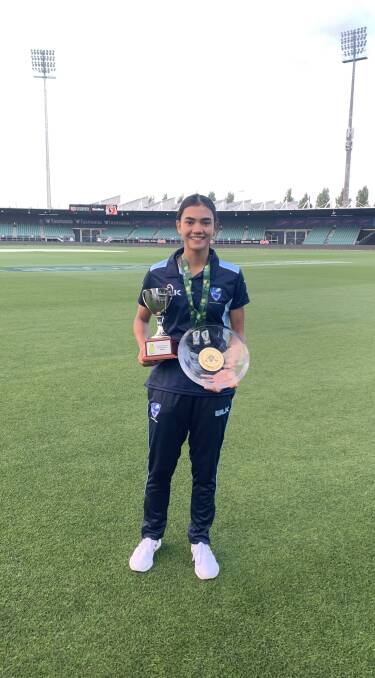 IMPRESSIVE: Sutcliffe poses after the under-18 national competition representing ACT-NSW with the T20 trophy and the 50 over shield.