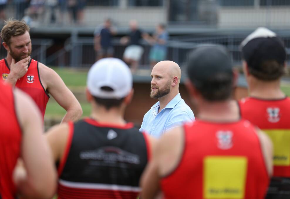 STAR: Gary Ablett chats to Saints players during
his visit to Myrtleford. Picture: TARA TREWHELLA
