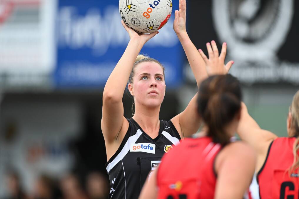 CONCENTRATION IS KEY: Wangaratta goaler Georgia Clark takes aim at the ring during the Magpies' Ovens and Murray netball clash against Myrtleford at Norm Minns Oval on Saturday. Picture: MARK JESSER