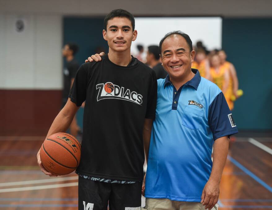 SPECIAL GUESTS: Fijian team organiser Alex Fong with son Keane at their first Australian Country Junior Basketball Cup opening ceremony in Wodonga. Pictures: MARK JESSER.
