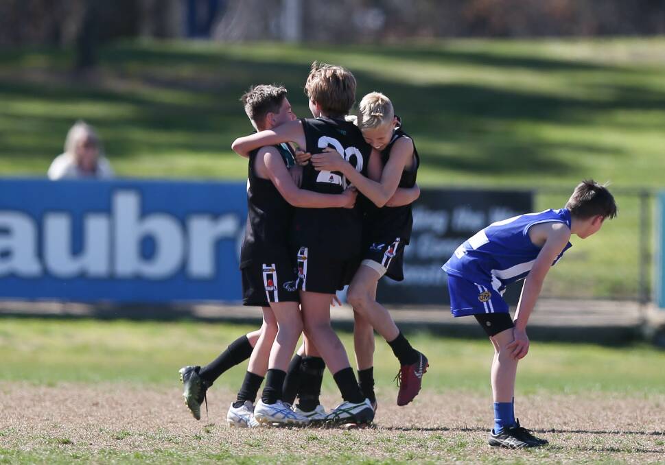 THAT TIME OF YEAR: Lavington's under-12s celebrate their win back in the AWJFL 2019 grand final. The league will resume play this weekend for the preliminary finals.