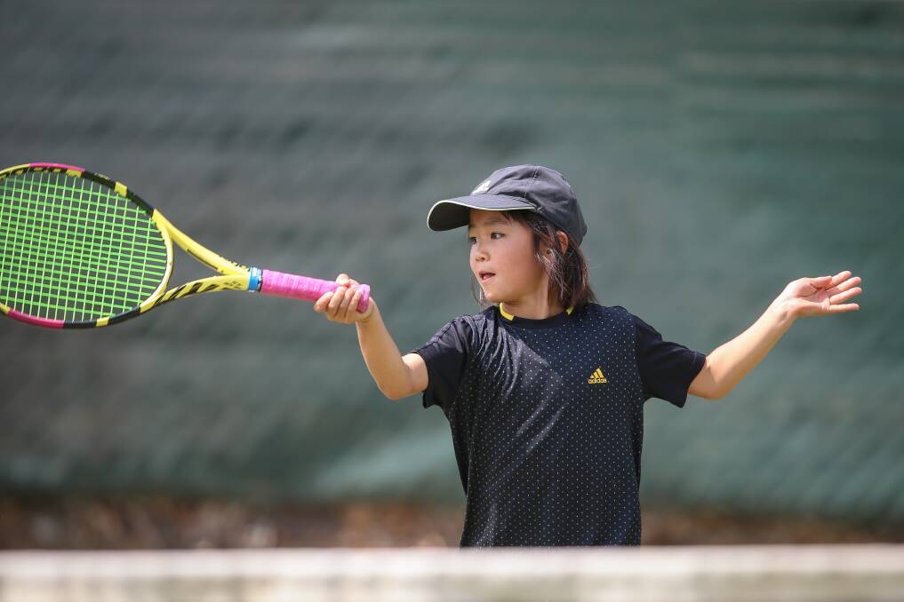 BIG SWING: Japan's Sakino Miyazawa eyes off a forehand during an under-10's singles match on the first day of the Margaret Court Cup.