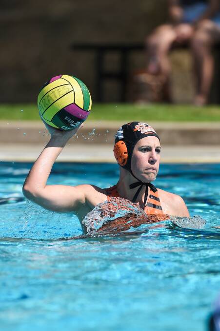 MAKING WAVES: Albury Tigers' Danielle Cale looks to pass in the pool during her side's loss to Pool Pirates on Sunday. Picture: MARK JESSER