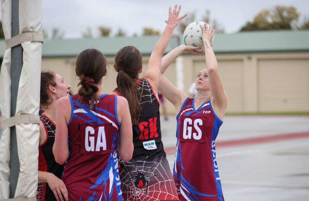 EYES ON THE PRIZE: Culcairn's Rachel Hensel lines up the shot under the defensive pressure of the Spiders at Howlong on the weekend. Picture: JAMES WILTSHIRE