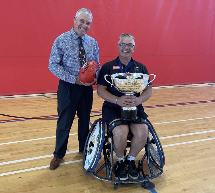 TEAMWORK: The Scots School Albury principal Mark Geraets alongside Collingwood Victorian Wheelchair Football League premiership player Brett Newman of Wodonga.