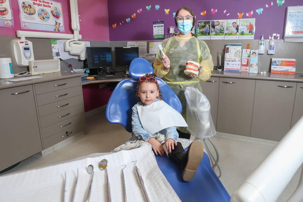 OPEN WIDE: Wodonga's Ava Pearsall gets ready for a dental check-up with Albury Wodonga Health's oral health educator Sinead McArdle. Picture: TARA TREWHELLA