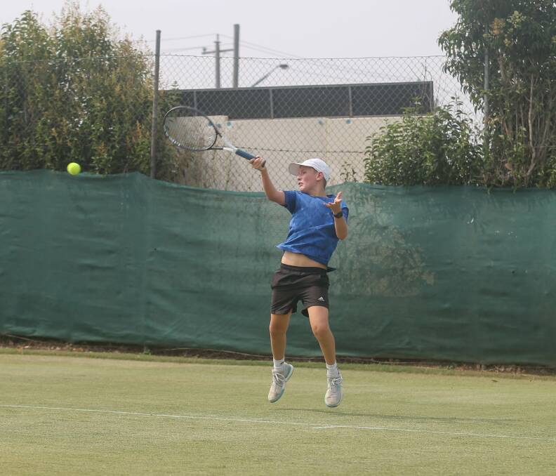CONCENTRATION: Albury's Billy Hilton lines up a forehand during a teams event match on his home courts on Thursday.