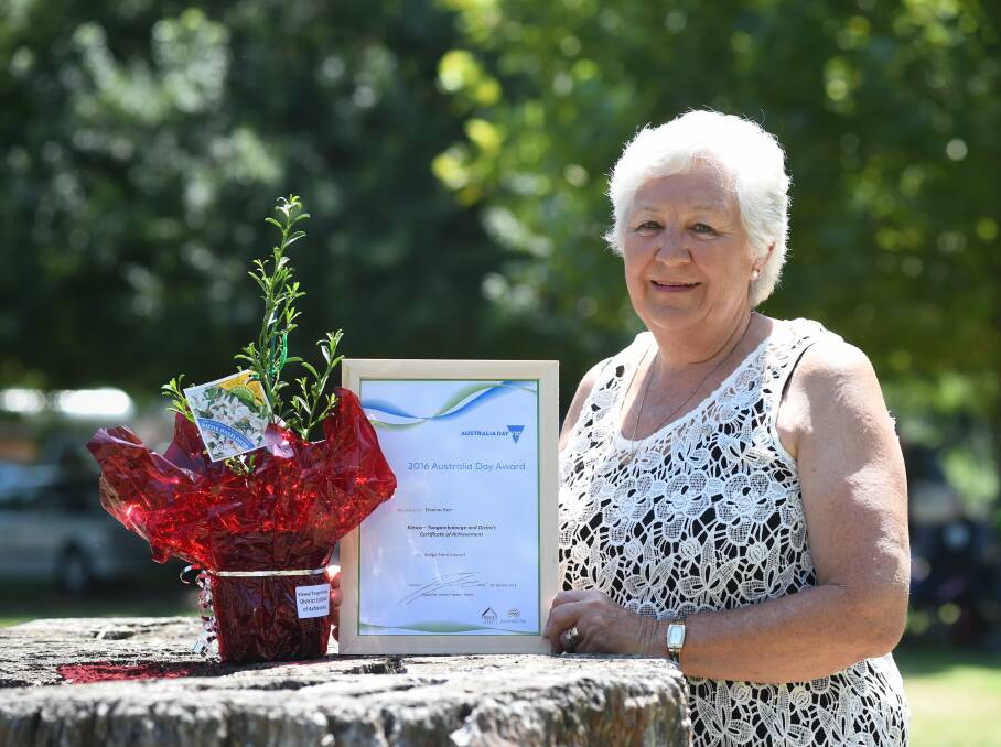 HONOURED: Di Kerr pictured with her certificate of achievement award on Australia Day in 2016 after 50 years of service to the Kiewa Sandy-Creek netball club.