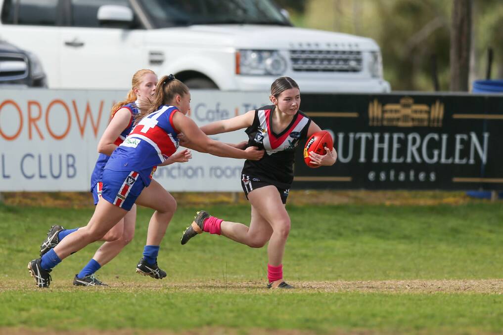 Thurgoona's Olivia Hall tries to wrap up Lavington's Lilly Owen in a tackle during the two sides clash on Sunday.
