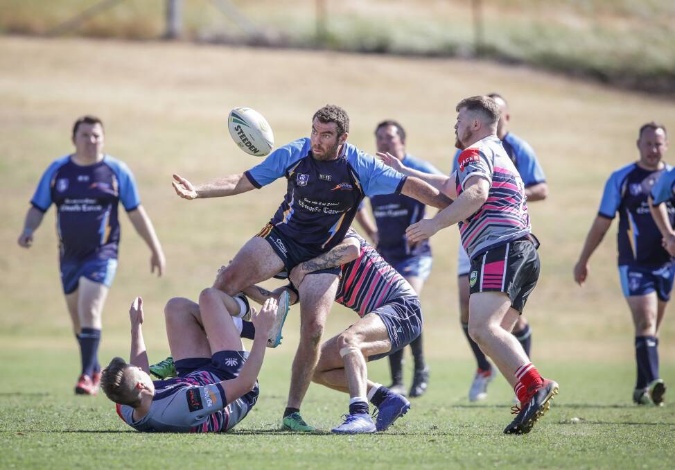 EYE ON THE BALL: Wodonga's Reg Williamson looks for the ball during the Storm's clash with Victoria Police Vikings during the Masters Rugby League carnival held in Wodonga on the weekend. Picture: JAMES WILTSHIRE.