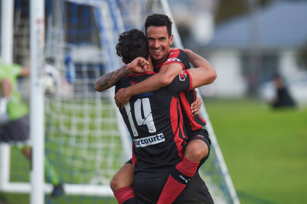 THRILLED: Wangaratta City's Adam Burchell and Nikala Bukvic celebrate Burchell's goal during the side's 7-0 win against Albury City at Jelbart Park on Sunday. Picture: MARK JESSER