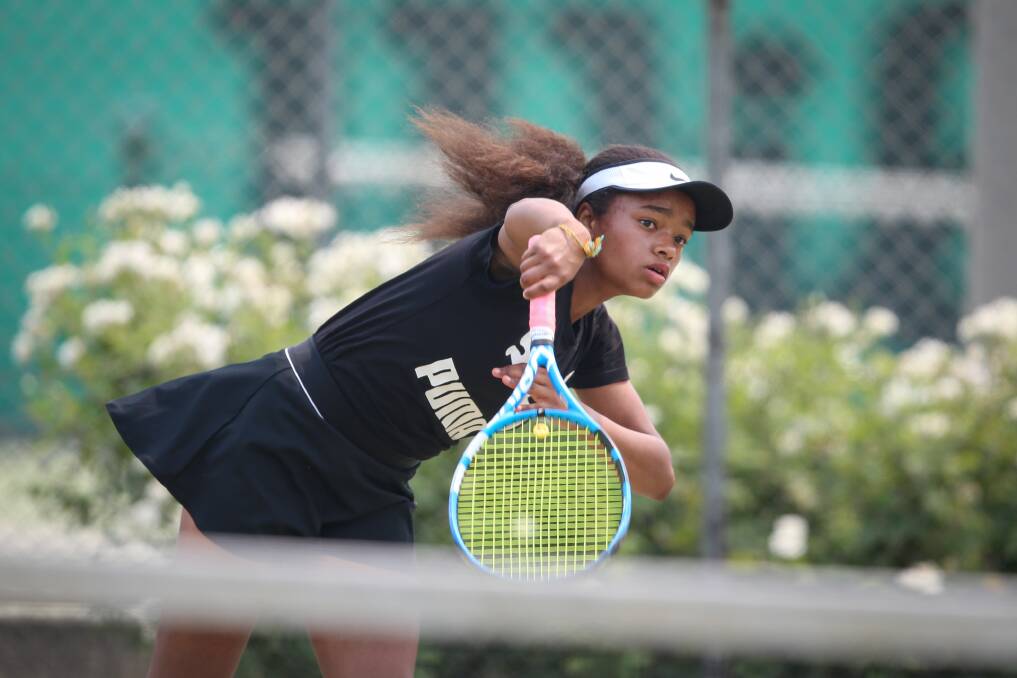 HOLDS SERVE: Wambui Taylor serves during her under-14's clash with Ruby Hodgkin at the Margaret Court Cup on Sunday.