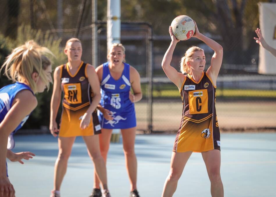 GAME ON: Rovers' Briony Simpson moves the ball down the court during the Hawks' clash against Corowa-Rutherglen in Wangaratta on Saturday. Picture: JAMES WILTSHIRE
